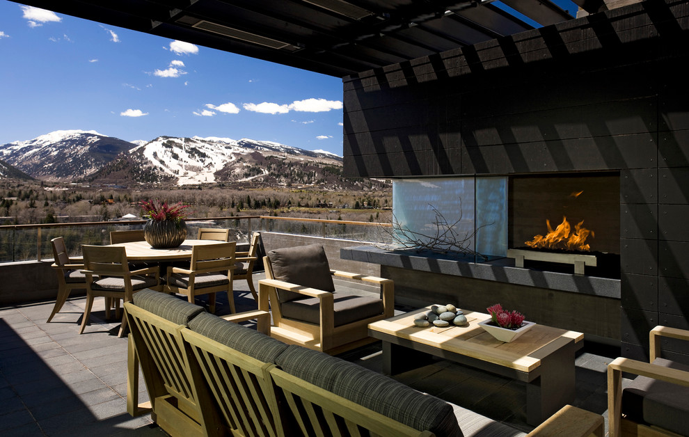 Design ideas for a contemporary deck in Denver with a fire feature.