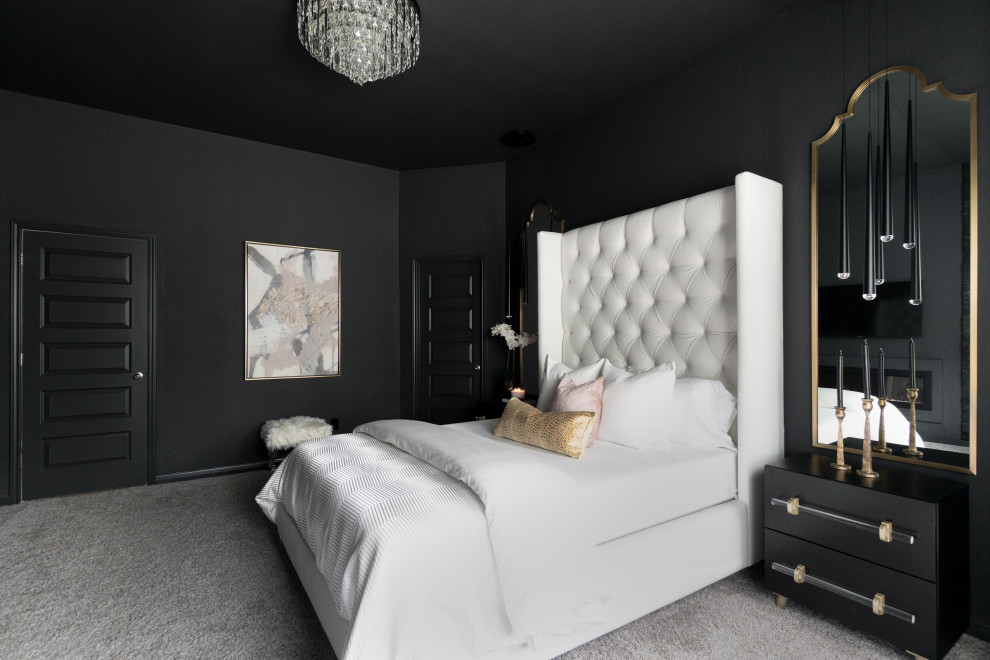 На фото: хозяйская спальня среднего размера в современном стиле с черными стенами, ковровым покрытием, стандартным камином, бежевым полом и панелями на части стены