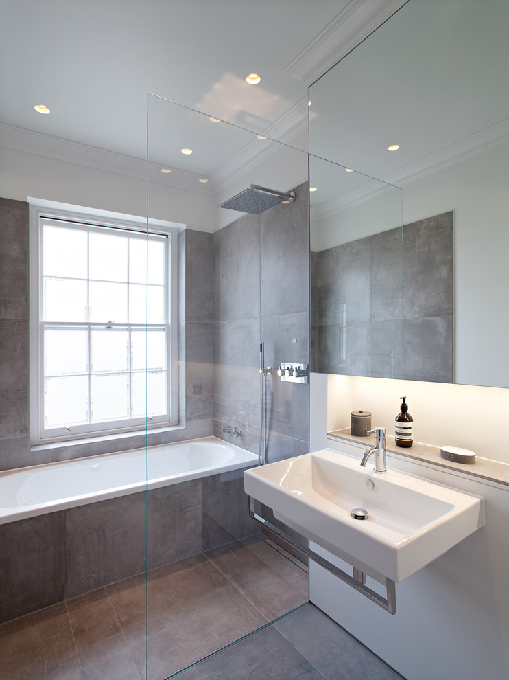 Design ideas for a contemporary bathroom in London with a wall-mount sink.