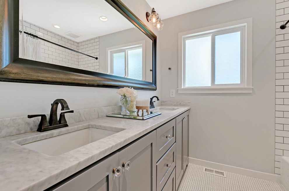 Bathroom - mid-sized transitional double-sink bathroom idea in Portland with shaker cabinets and a built-in vanity