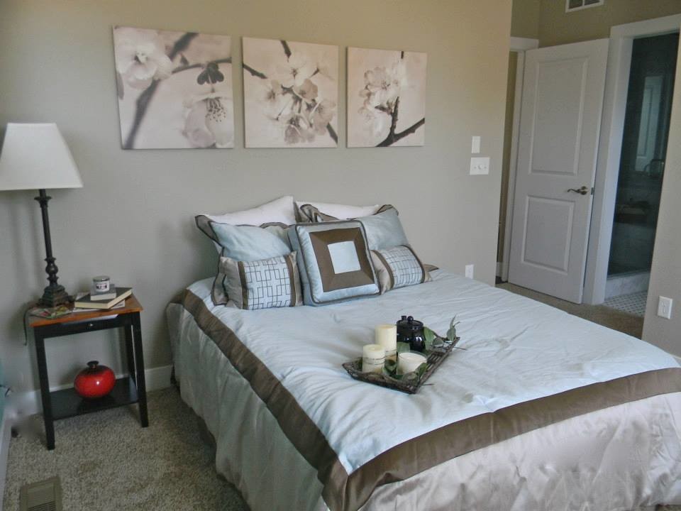 Design ideas for a mid-sized asian guest bedroom in Denver with beige walls, carpet and beige floor.