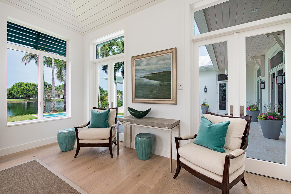 Example of a large transitional formal, open concept and master medium tone wood floor and brown floor bedroom design in Miami with white walls, no fireplace and no tv