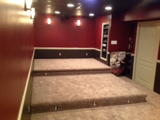Design ideas for a small transitional fully buried basement in Newark with red walls, carpet and beige floor.