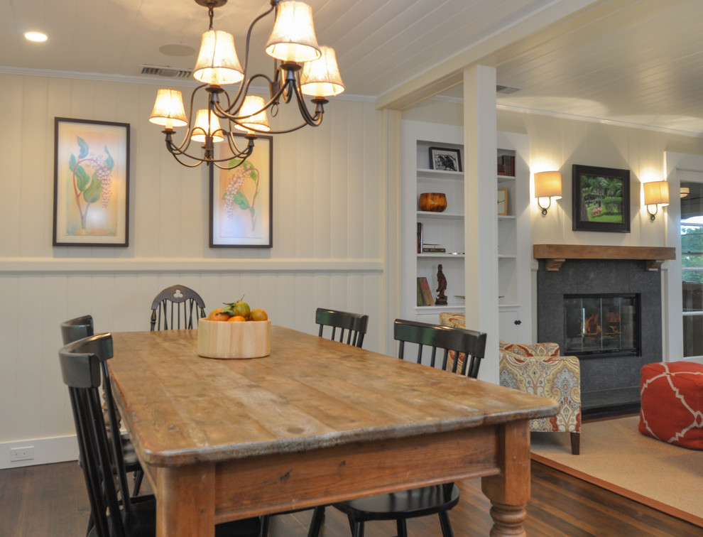 Example of a mid-sized transitional dark wood floor and brown floor great room design with a stone fireplace, brown walls and no fireplace