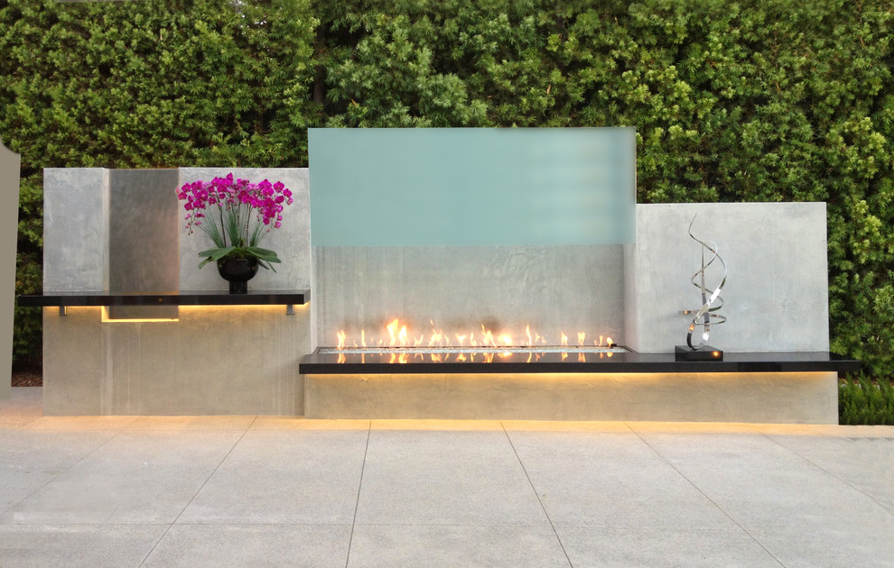 Design ideas for a contemporary backyard patio in Los Angeles with concrete pavers and no cover.
