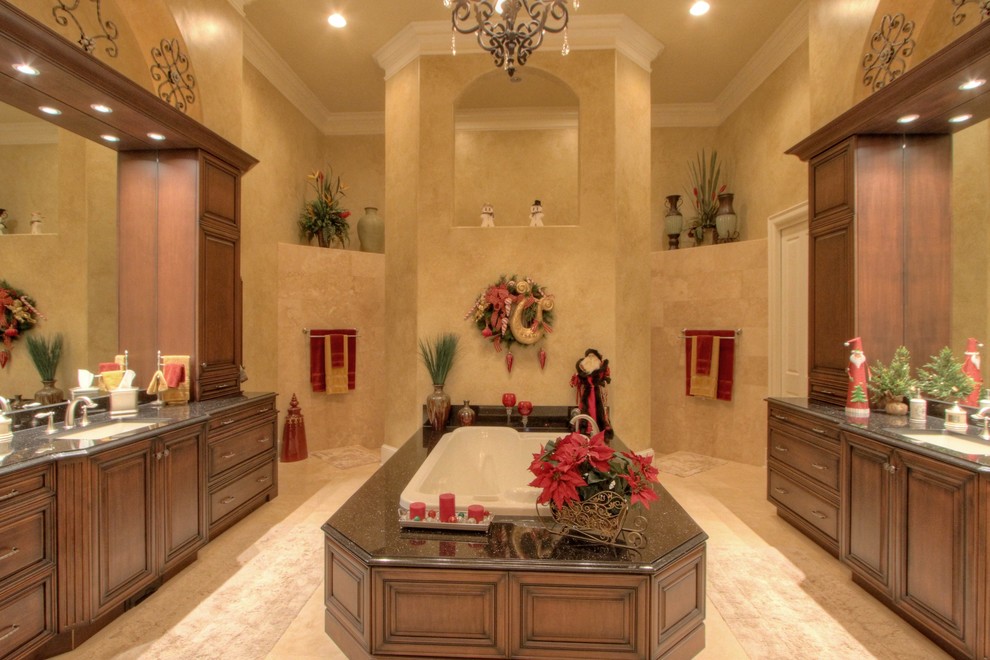 Design ideas for a mediterranean bathroom in Atlanta with beige tile and stone tile.