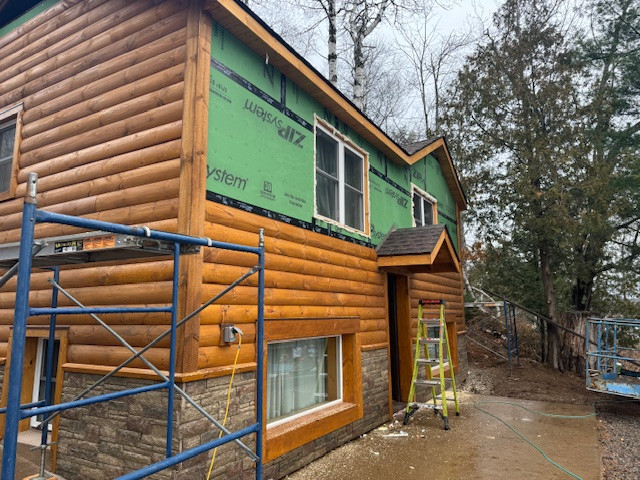 Log Siding, Stamped Concrete and Post and Beam Carport