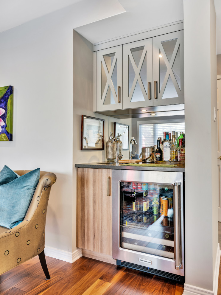 Design ideas for a contemporary home bar in Ottawa with medium hardwood flooring.