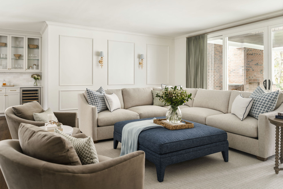 Inspiration for a large transitional open concept dark wood floor, wainscoting and brown floor family room remodel in Charlotte with white walls, a standard fireplace and a stone fireplace