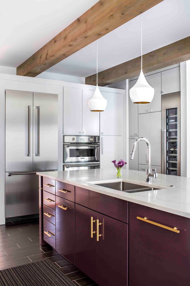 Inspiration for a contemporary l-shaped eat-in kitchen in Atlanta with a double-bowl sink, flat-panel cabinets, purple cabinets, quartz benchtops, stainless steel appliances, with island and black floor.