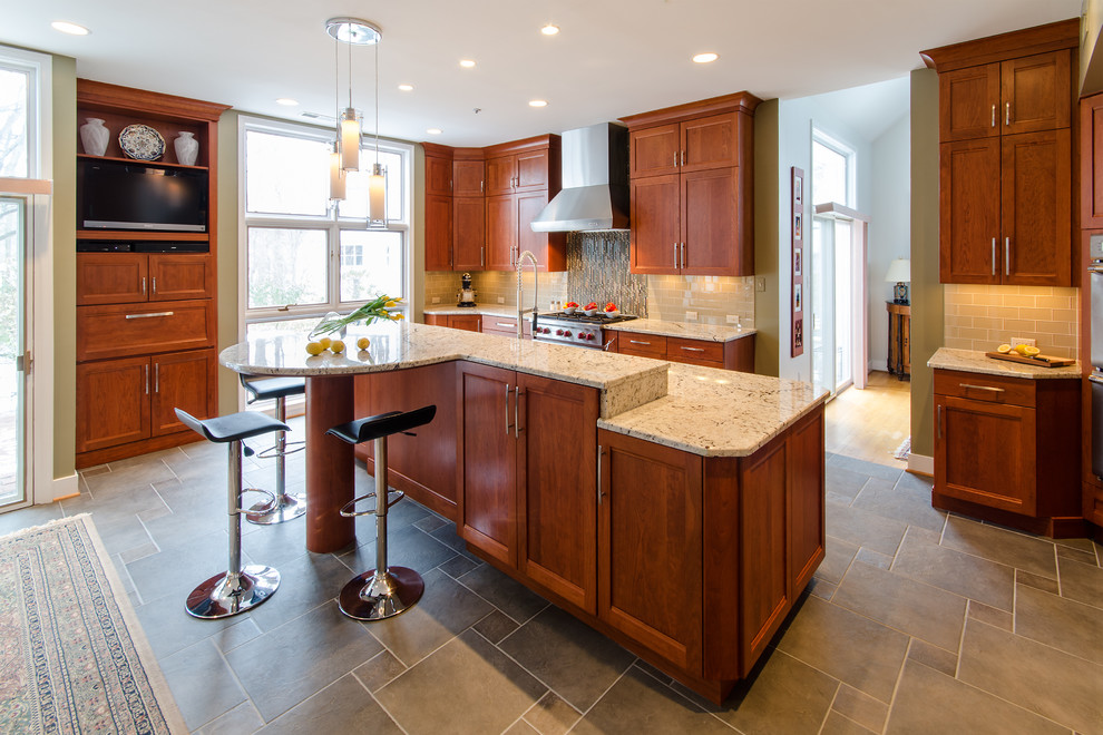 Kitchen - transitional kitchen idea in Richmond with flat-panel cabinets, medium tone wood cabinets, granite countertops, beige backsplash, stainless steel appliances, an island and an undermount sink
