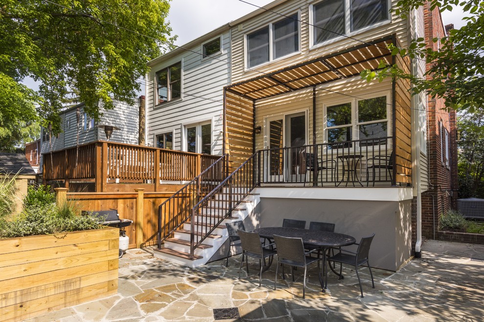 Inspiration for a small transitional backyard deck remodel in DC Metro with a pergola