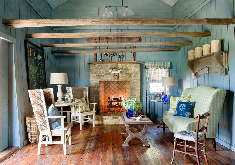 Inspiration for a country living room in Atlanta with blue walls, a standard fireplace, medium hardwood floors and a stone fireplace surround.