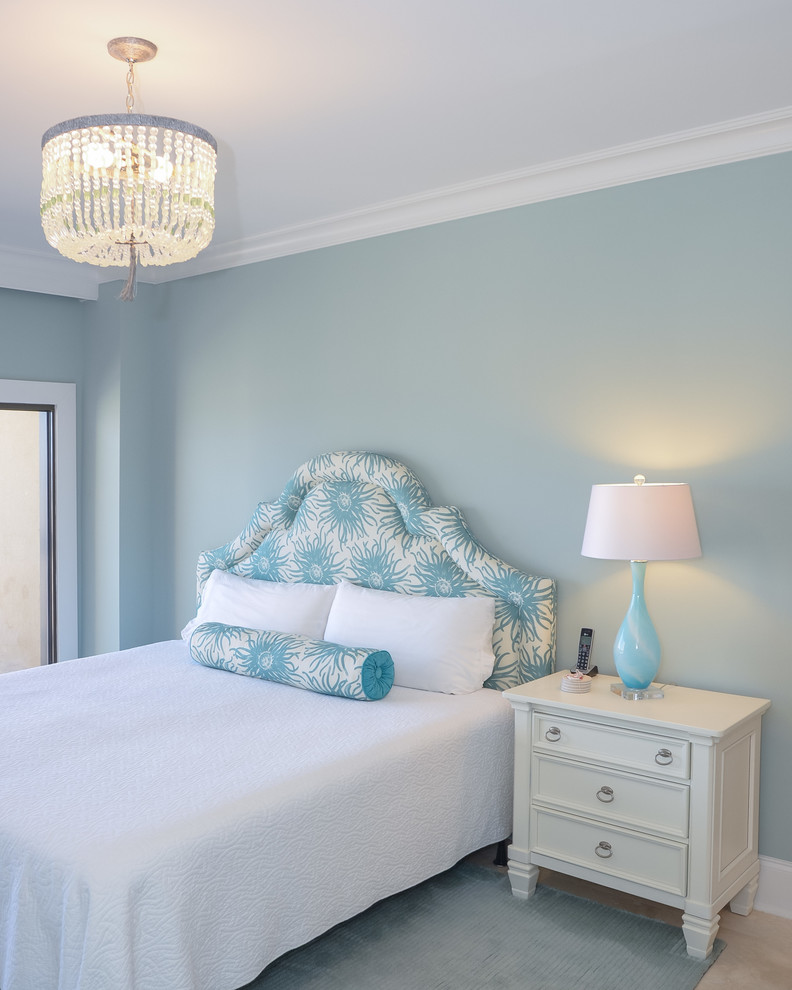 This is an example of a mid-sized beach style guest bedroom in Charleston with blue walls and no fireplace.