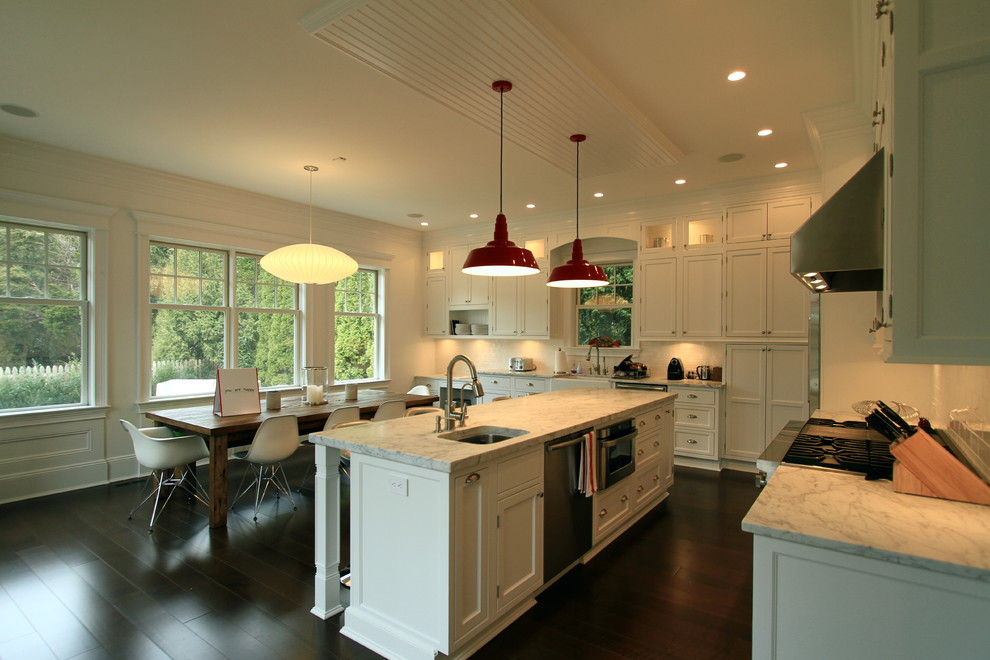 Design ideas for a contemporary eat-in kitchen in New York with white cabinets and stainless steel appliances.