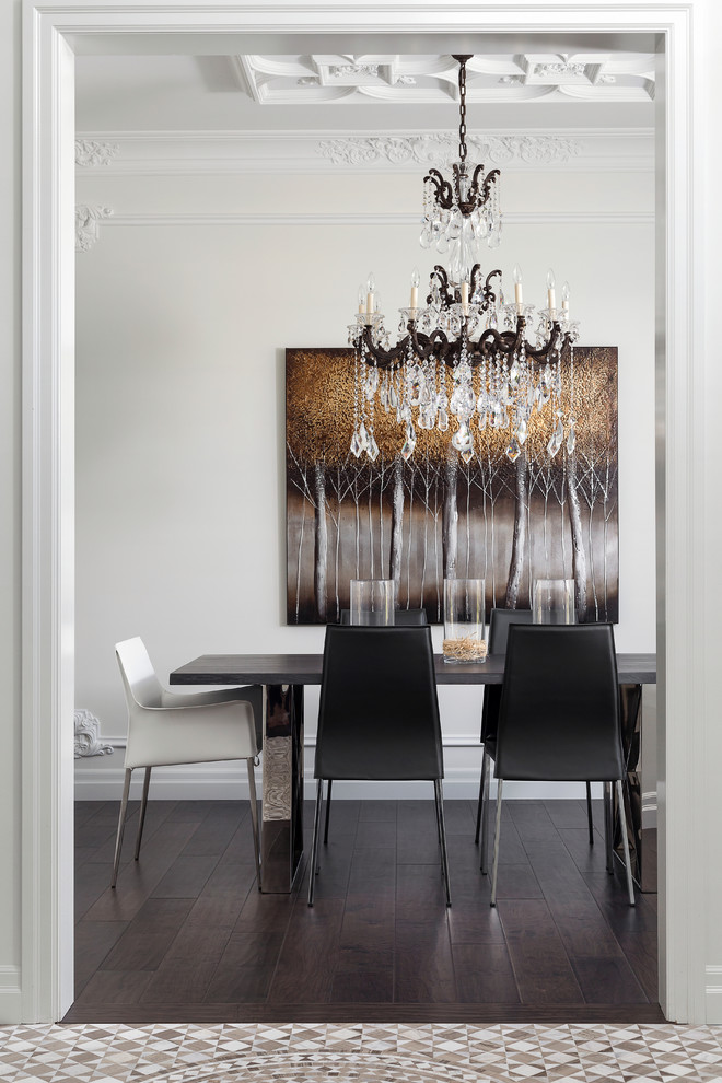 Photo of a traditional separate dining room in Toronto with white walls and dark hardwood floors.