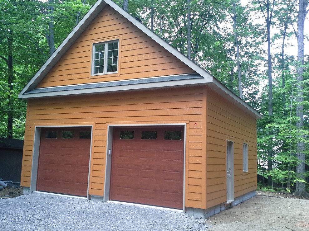 Inspiration for a mid-sized country detached two-car garage in Montreal.