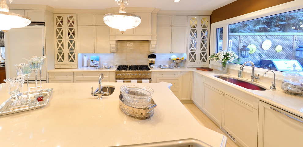 Design ideas for a mid-sized traditional l-shaped eat-in kitchen in Calgary with an undermount sink, shaker cabinets, white cabinets, quartz benchtops, white splashback, porcelain splashback, stainless steel appliances, porcelain floors and with island.
