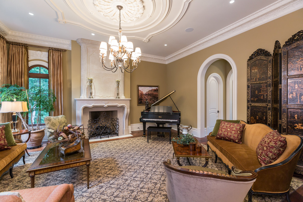 This is an example of an expansive traditional formal enclosed living room in DC Metro with beige walls, medium hardwood floors, a standard fireplace, a stone fireplace surround and no tv.