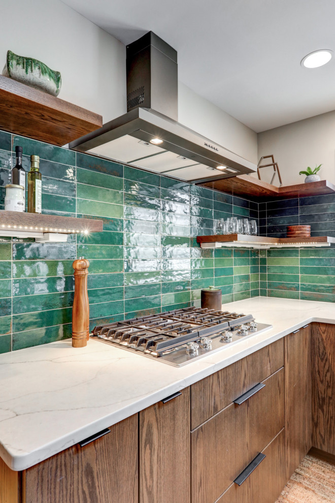 Inspiration for a large midcentury u-shaped eat-in kitchen in Other with an undermount sink, flat-panel cabinets, dark wood cabinets, quartz benchtops, green splashback, ceramic splashback, stainless steel appliances, cork floors, with island, brown floor and white benchtop.