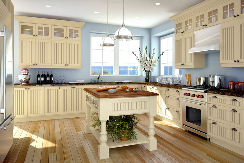 Eat-in kitchen - mid-sized transitional l-shaped eat-in kitchen idea in Seattle with white cabinets and an island