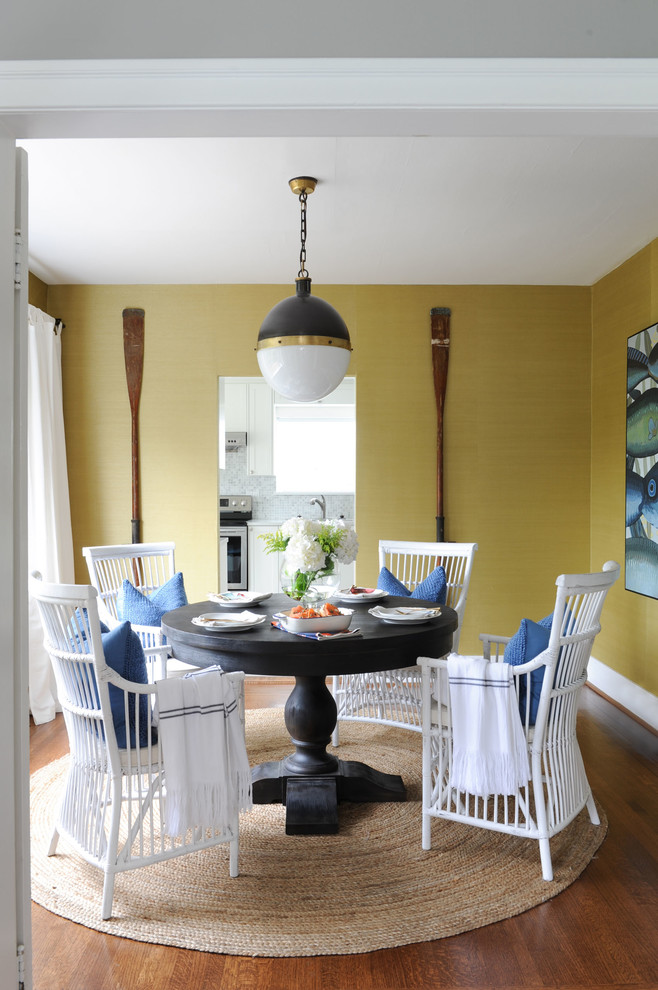 Inspiration for a transitional dining room in Other with yellow walls, medium hardwood floors and brown floor.