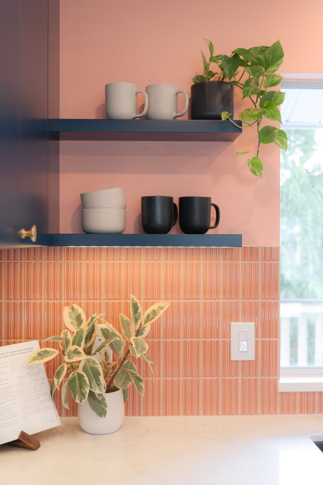 Small transitional u-shaped terrazzo floor and white floor eat-in kitchen photo in Vancouver with a farmhouse sink, flat-panel cabinets, light wood cabinets, quartz countertops, pink backsplash, porcelain backsplash, stainless steel appliances, an island and white countertops