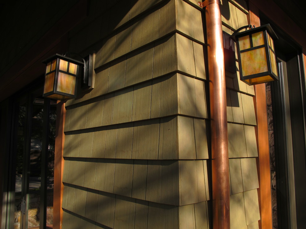Inspiration for an expansive arts and crafts two-storey green exterior in San Francisco with wood siding.