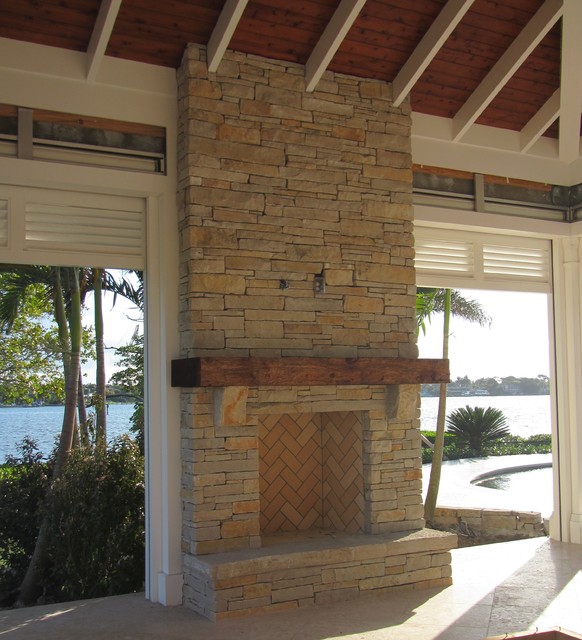 Outdoor fireplace limestone and wood mantel Craftsman Patio Other by Waterfalls