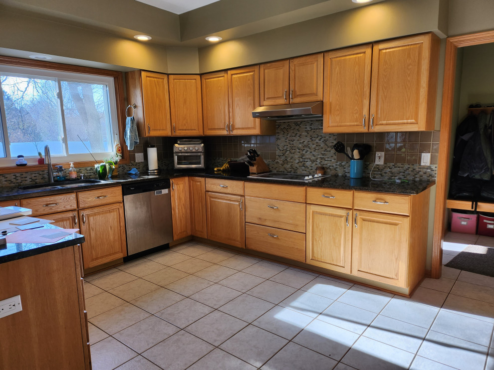 Large transitional u-shaped open concept kitchen photo with shaker cabinets, medium tone wood cabinets, quartzite countertops, white backsplash, ceramic backsplash, stainless steel appliances, a peninsula and white countertops