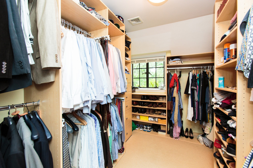 Inspiration for an expansive midcentury walk-in wardrobe in Boston with carpet.