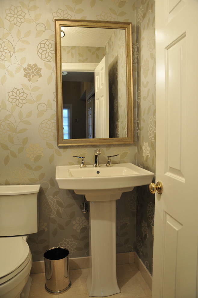 Design ideas for a mid-sized traditional powder room in Boston with a pedestal sink, a two-piece toilet, beige walls, ceramic floors and beige floor.