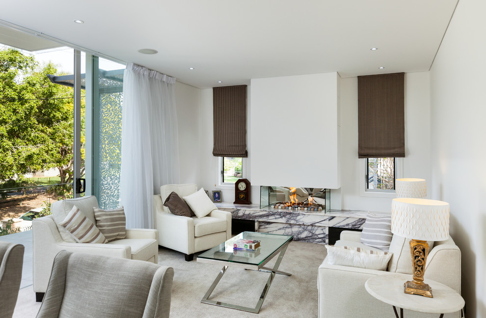 Photo of a contemporary formal living room in Brisbane with white walls, carpet, a ribbon fireplace and a plaster fireplace surround.