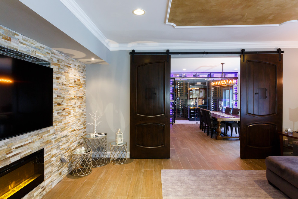 This is an example of a mid-sized contemporary wine cellar in New York with marble floors and display racks.