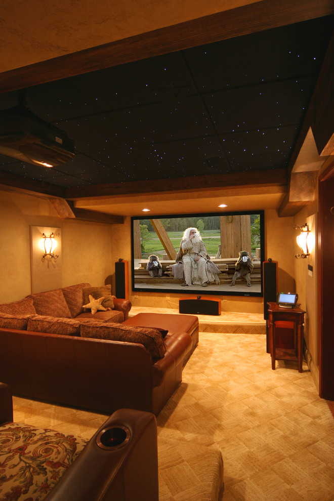 Photo of a traditional enclosed home theatre in DC Metro with carpet and a projector screen.