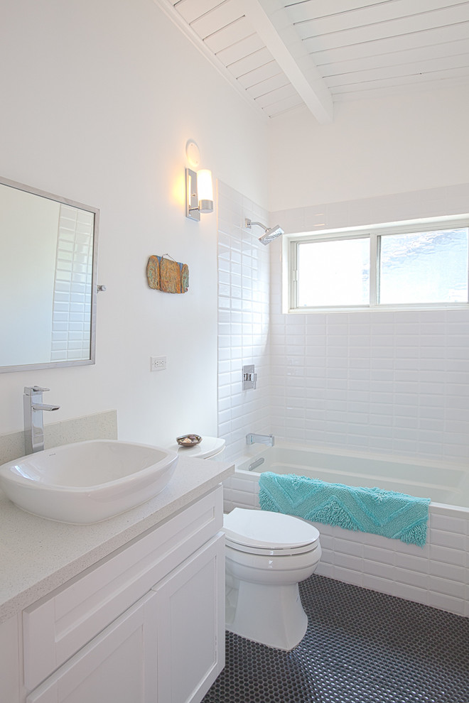 Photo of a midcentury bathroom in Other with a vessel sink.