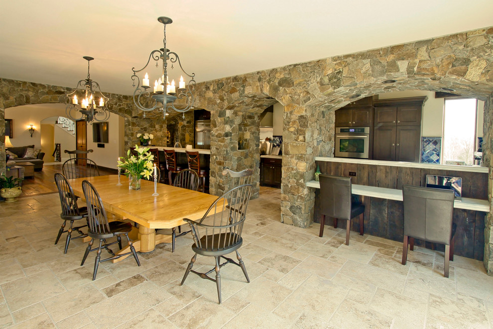 This is an example of a country dining room in New York with ceramic floors.