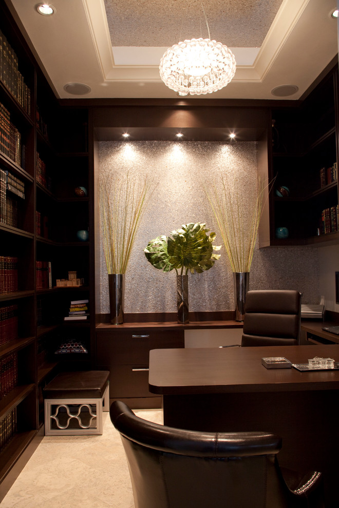 Inspiration for a mid-sized contemporary home office in Miami with beige walls, porcelain floors and a built-in desk.