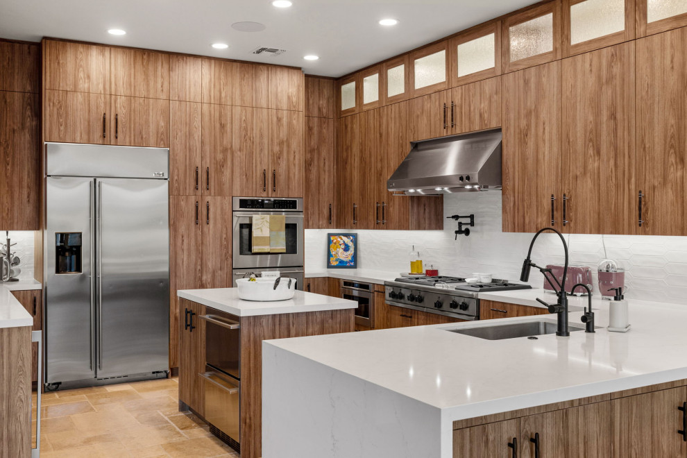 Mountain style l-shaped slate floor and beige floor enclosed kitchen photo with a single-bowl sink, flat-panel cabinets, medium tone wood cabinets, quartzite countertops, white backsplash, glass sheet backsplash, stainless steel appliances, a peninsula and white countertops