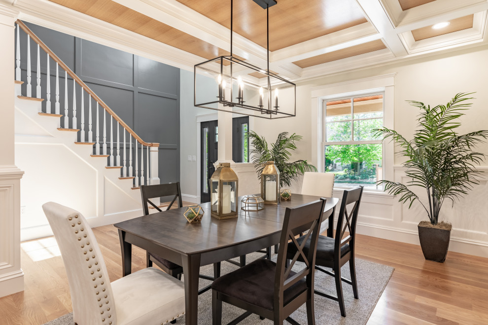 Inspiration for a large transitional open plan dining in Boston with beige walls, medium hardwood floors, brown floor, coffered and decorative wall panelling.