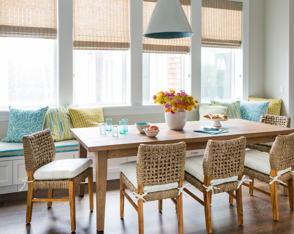 Photo of a beach style dining room in Jacksonville with grey walls and medium hardwood floors.