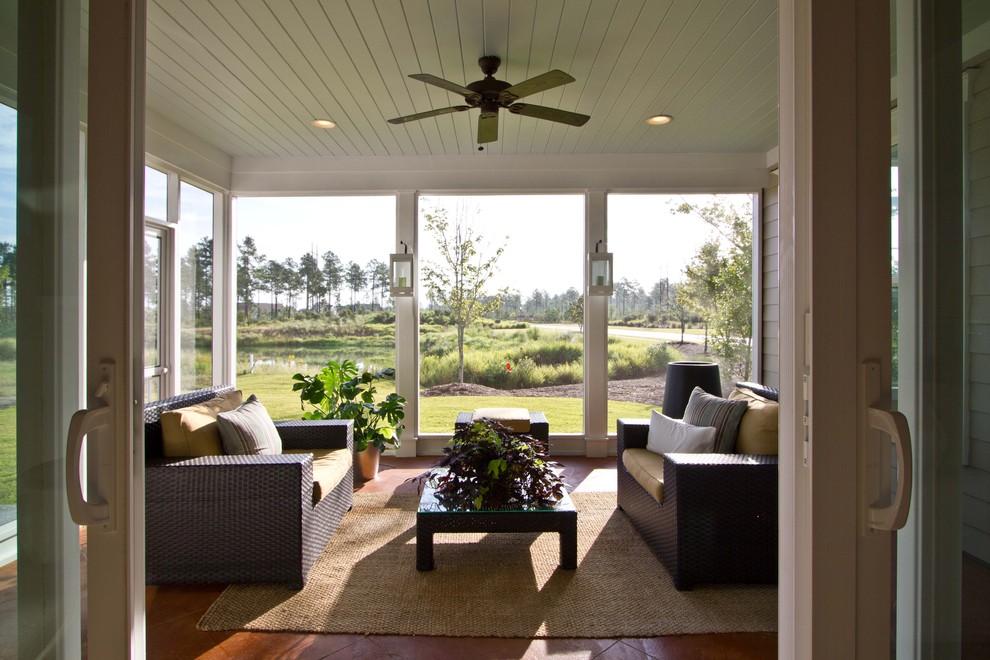 Inspiration for a large traditional backyard screened-in verandah in Other with tile and a roof extension.