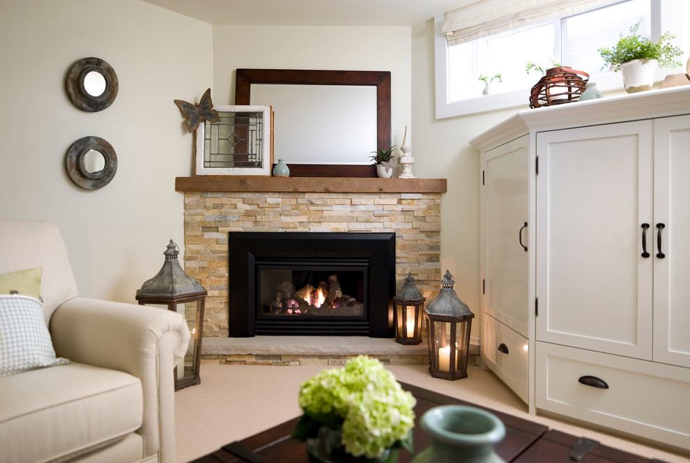 This is an example of a traditional basement in Toronto with a corner fireplace.