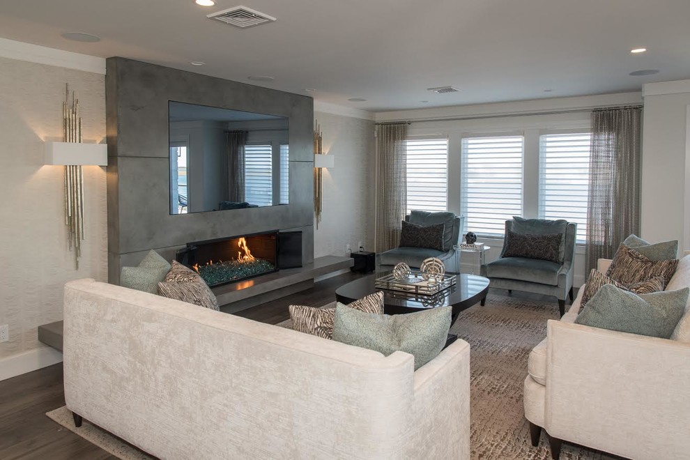 Photo of a mid-sized contemporary formal open concept living room in New York with grey walls, dark hardwood floors, a ribbon fireplace, a concrete fireplace surround, no tv and brown floor.
