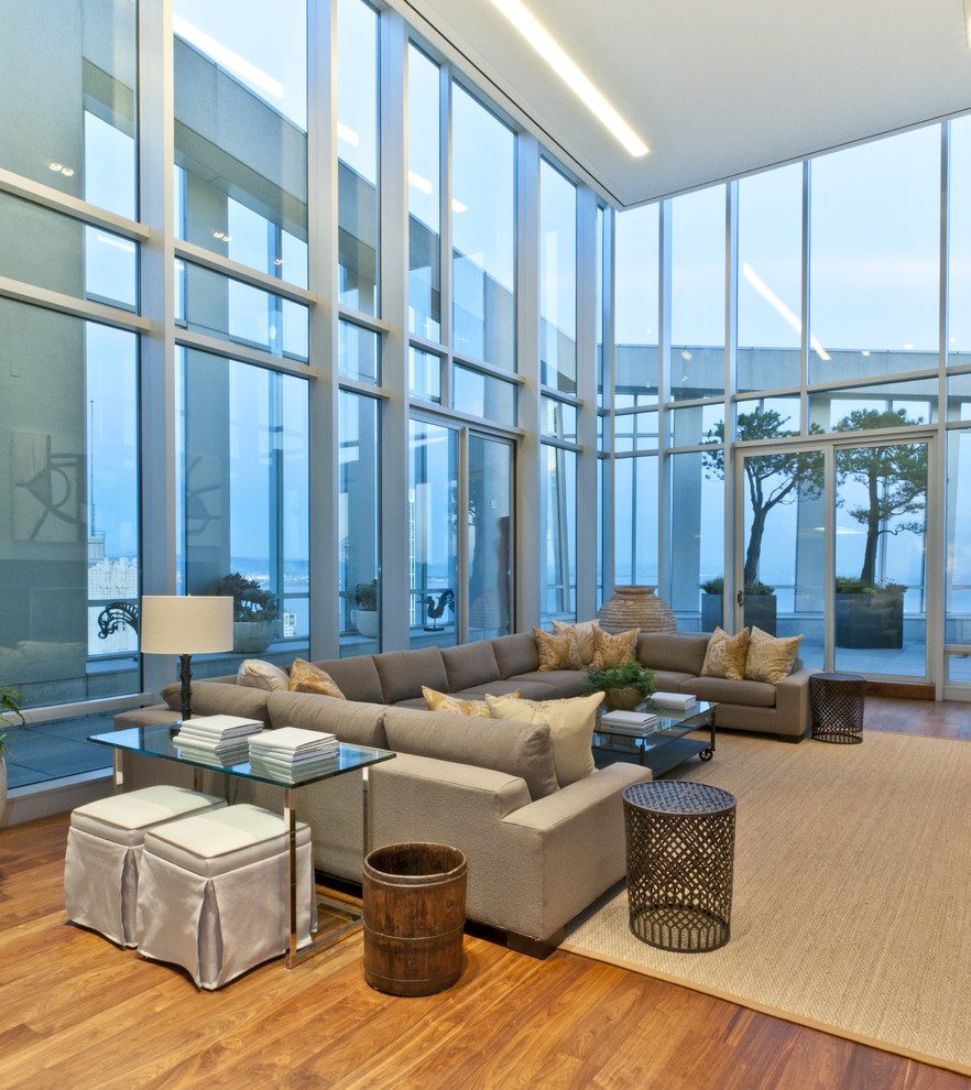 Contemporary open concept family room in San Francisco with medium hardwood floors.