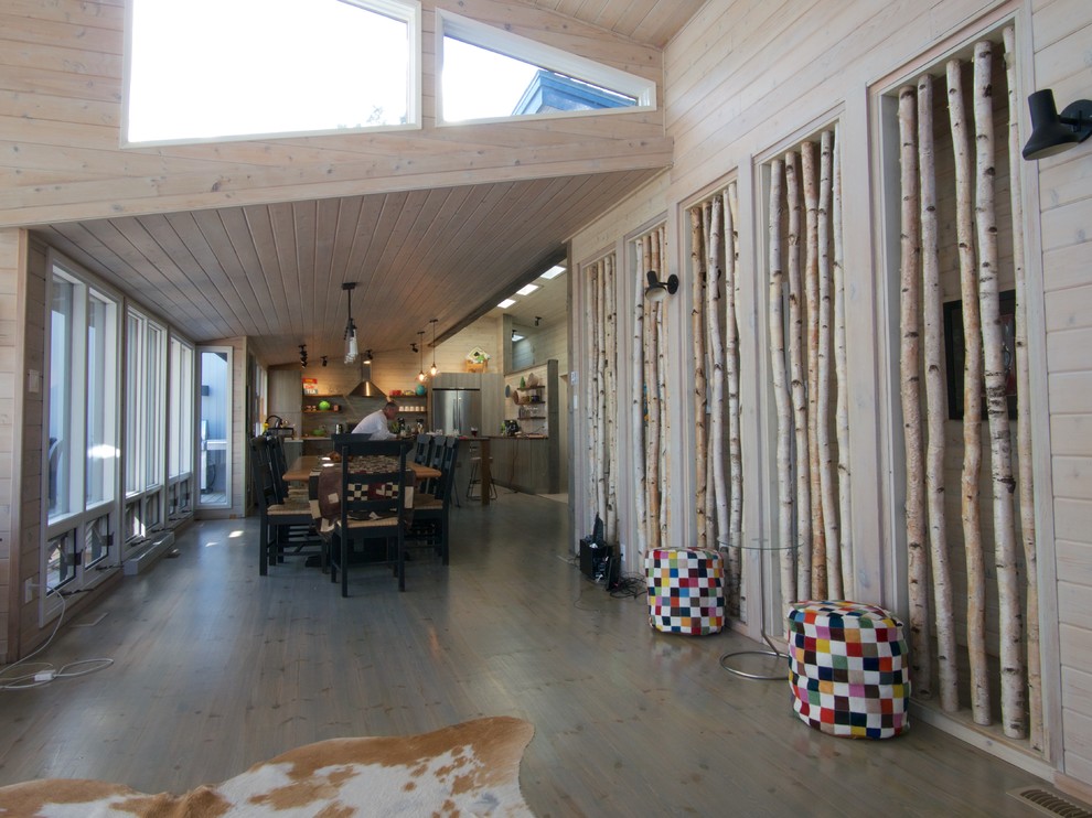Large transitional light wood floor kitchen/dining room combo photo with gray walls