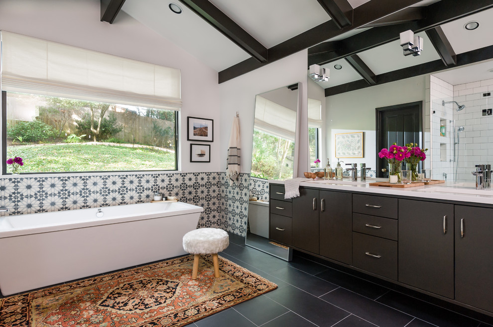 Example of a large transitional master multicolored tile and ceramic tile slate floor and gray floor freestanding bathtub design in Austin with an undermount sink, white walls, flat-panel cabinets, brown cabinets and a hinged shower door