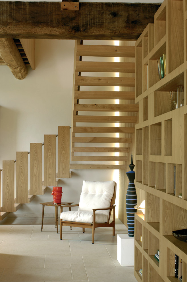This is an example of a country wood l-shaped staircase in London with open risers.