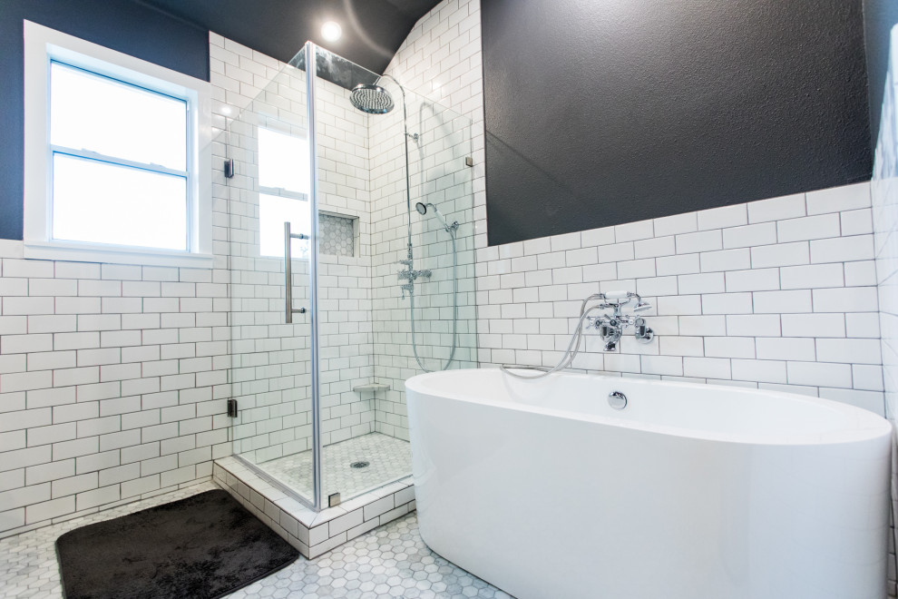 Inspiration for a large transitional master bathroom in Austin with furniture-like cabinets, grey cabinets, a freestanding tub, a corner shower, a two-piece toilet, white tile, ceramic tile, grey walls, ceramic floors, an undermount sink, quartzite benchtops, grey floor, a hinged shower door and white benchtops.