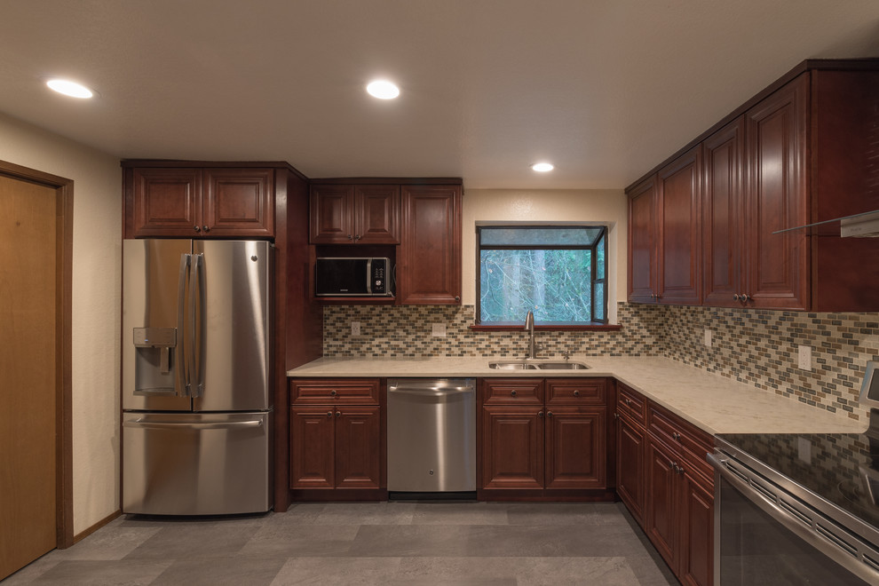 Inspiration for a mid-sized transitional u-shaped ceramic tile and gray floor enclosed kitchen remodel in Seattle with an undermount sink, beaded inset cabinets, dark wood cabinets, quartz countertops, multicolored backsplash, ceramic backsplash, stainless steel appliances and no island